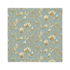 Turquoise & Gold Magnolia Dreams decorative pillow featuring magnolias, hummingbirds and butterflies in a muted gold tone 