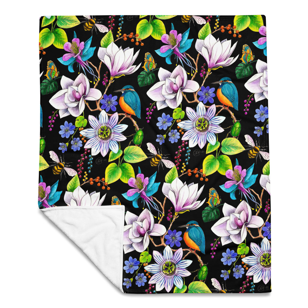 Garden of Eden throw blanket showing the full colorful floral pattern with exotic flowers, kingfishers, butterflies, bumblebees and green leaves on a black background