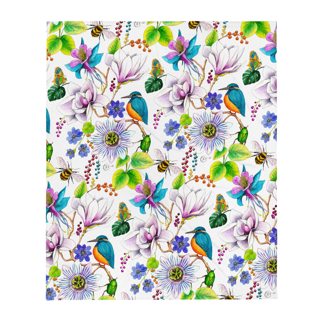 Garden of Eden throw blanket displaying a colorful pattern of exotic flowers, kingfishers, bumblebees, butterflies and lush green leaves