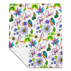 Garden of Eden throw blanket with a colorful floral pattern featuring kingfishers, exotic flowers, bumblebees and leaves