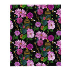 Dahlia Garden throw blanket displaying the full floral pattern with pink flowers, green leaves, birdcages and decorative keys