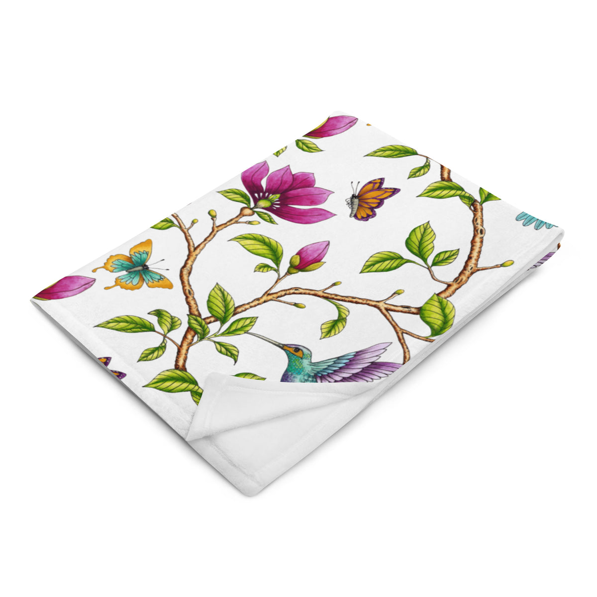 Magnolia Dreams throw blanket displaying pink magnolia blossoms, colorful hummingbirds, butterflies and green leaves on a white background
