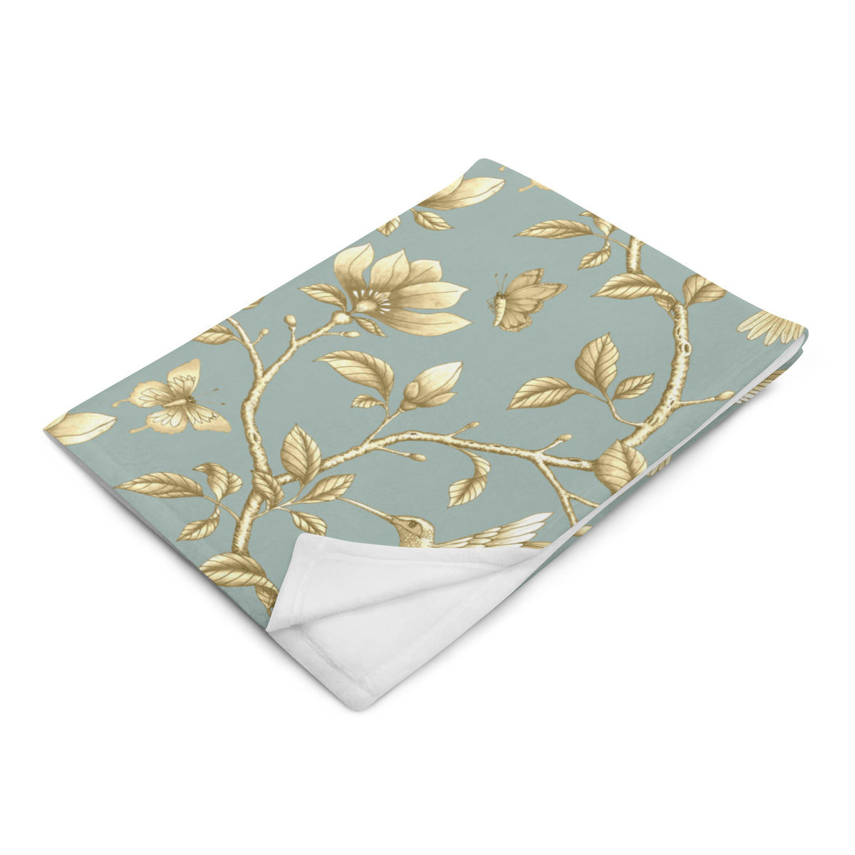 Magnolia Dreams Gilded Garden throw blanket in Turquoise & Gold, featuring golden magnolia blossoms, hummingbirds, butterflies and leafy branches