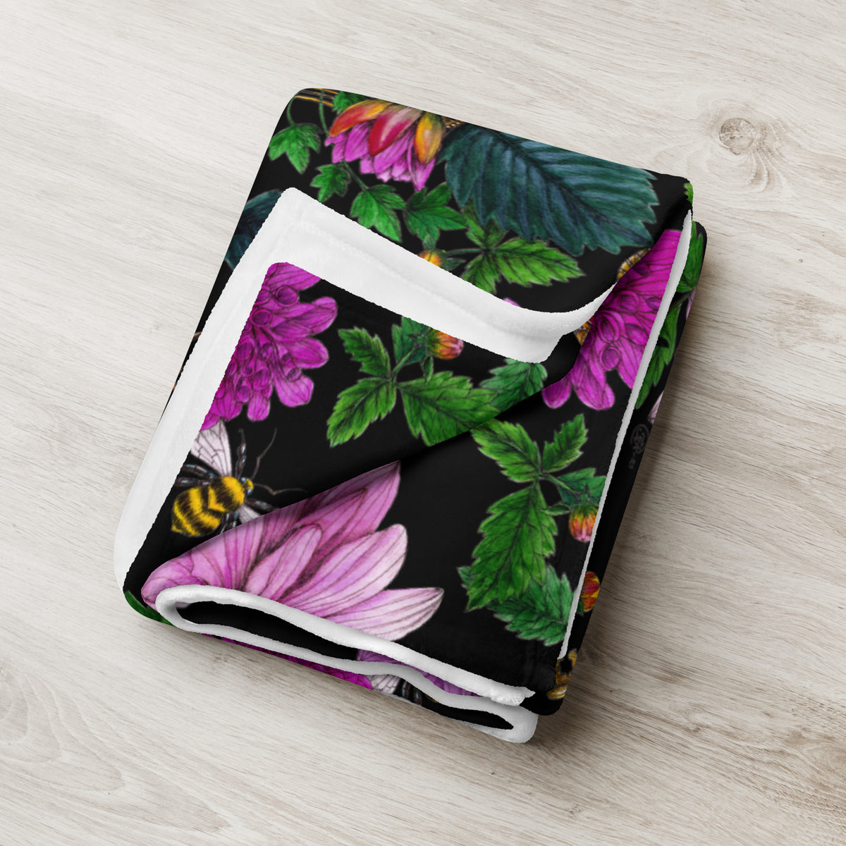 Folded throw blanket featuring the Dahlia Garden floral pattern
