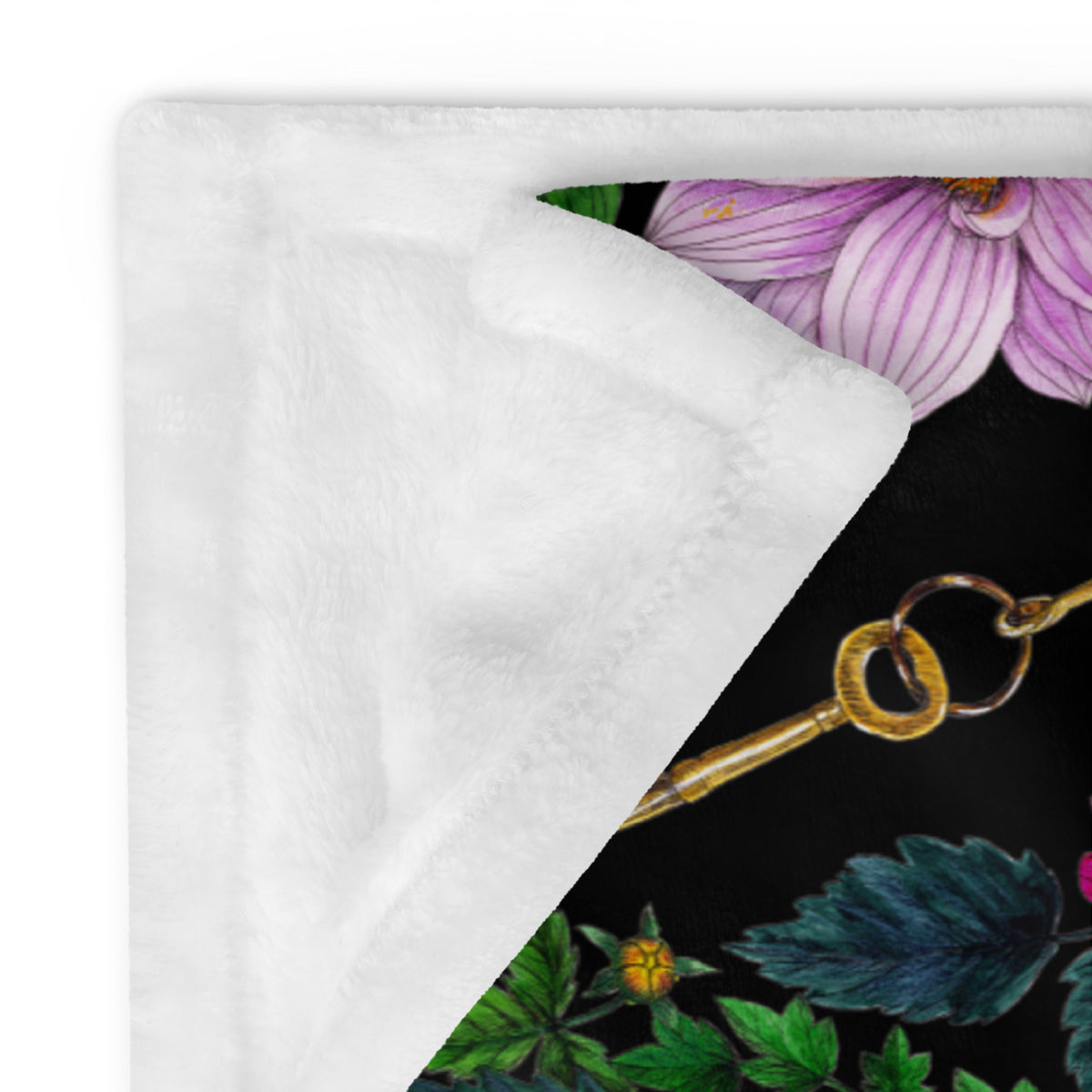 Close-up of a soft throw blanket featuring the Dahlia Garden floral pattern